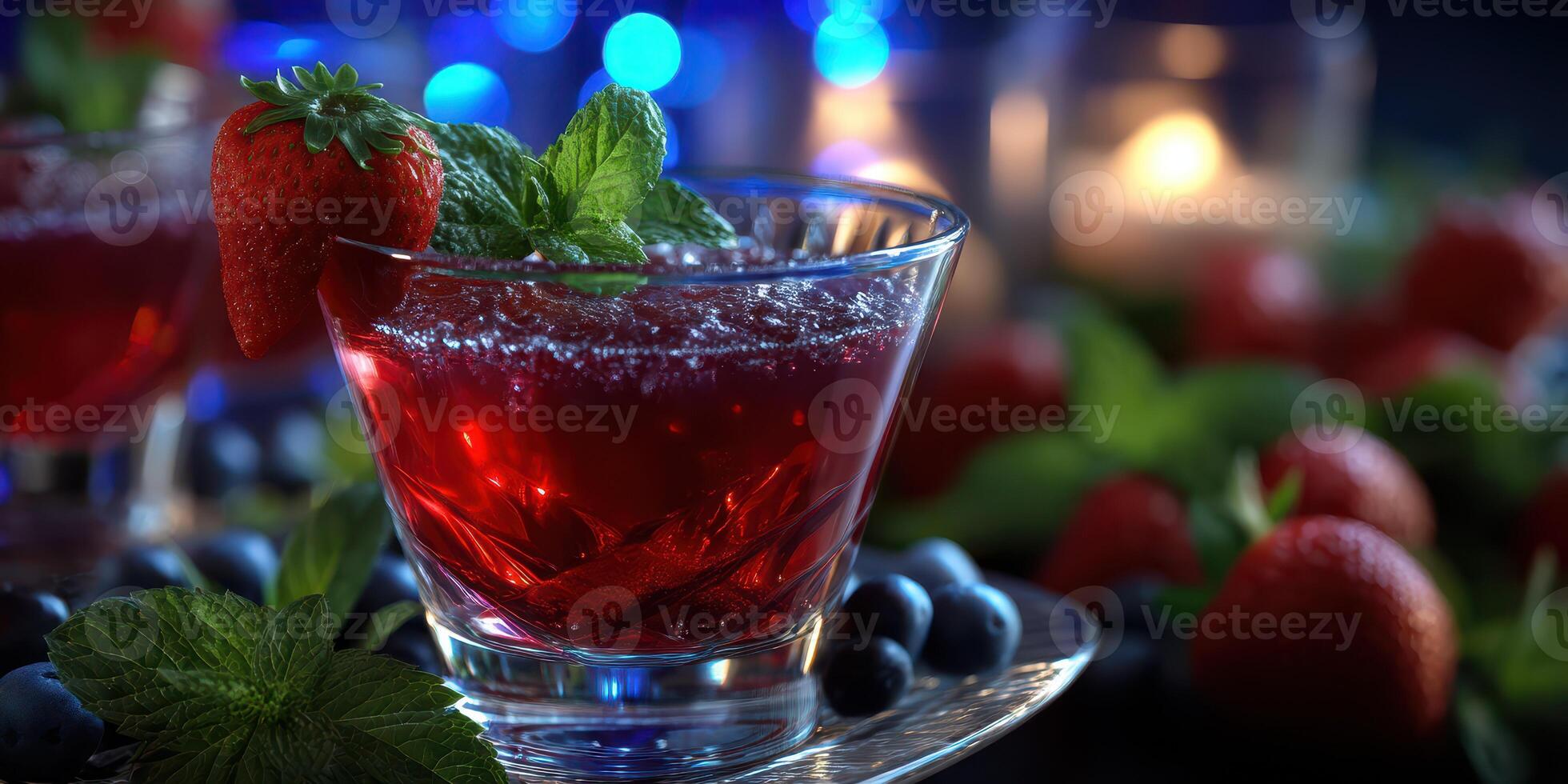 Refreshing berry cocktail served in a glass garnished with mint and strawberries at an evening gathering photo