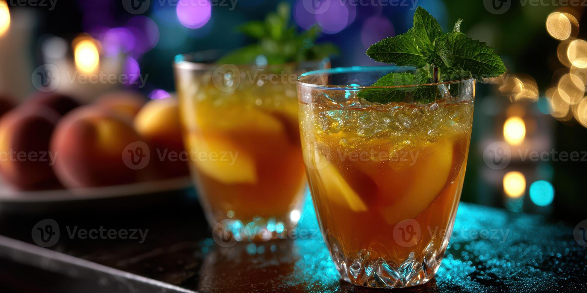 Refreshing iced tea with peach slices and mint served in glasses, perfect for summer evenings or gatherings outdoors photo
