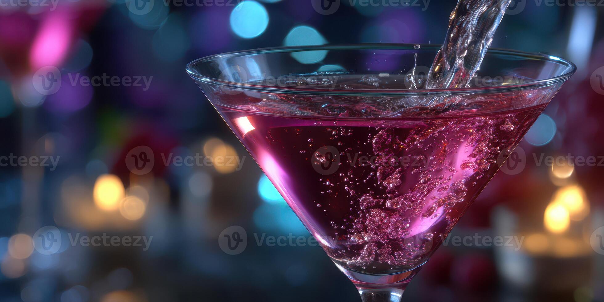Mixing a vibrant pink cocktail in an elegant glass at a social event with ambient lighting photo