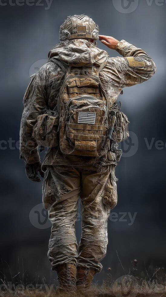 Soldier saluting while wearing tactical gear in a rugged landscape during a cloudy day photo