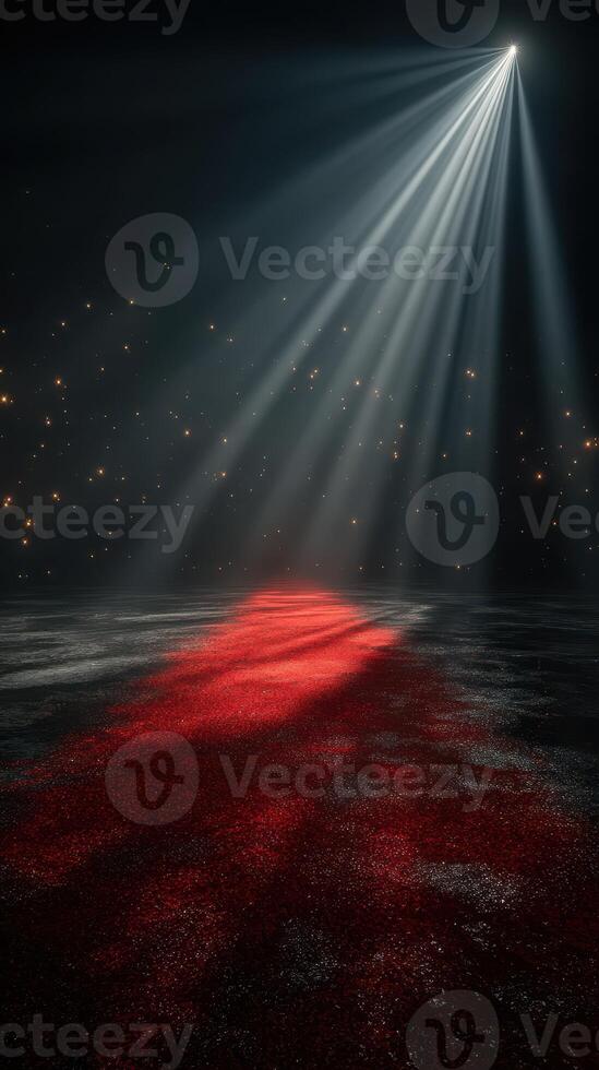 Spotlight shines on a shimmering red carpet leading to an unknown destination in a dimly lit space with scattered lights photo