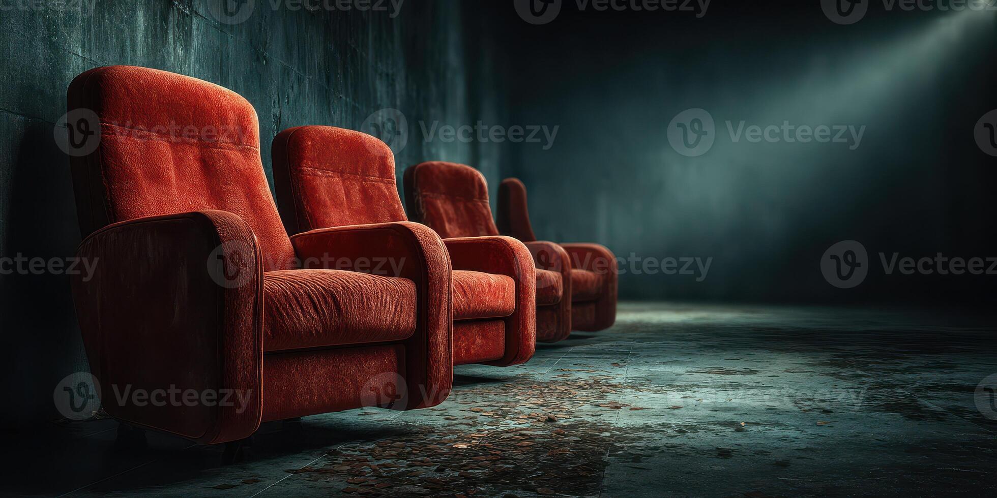 Deserted red chairs in a dimly lit industrial space create a nostalgic atmosphere of solitude and reflection photo