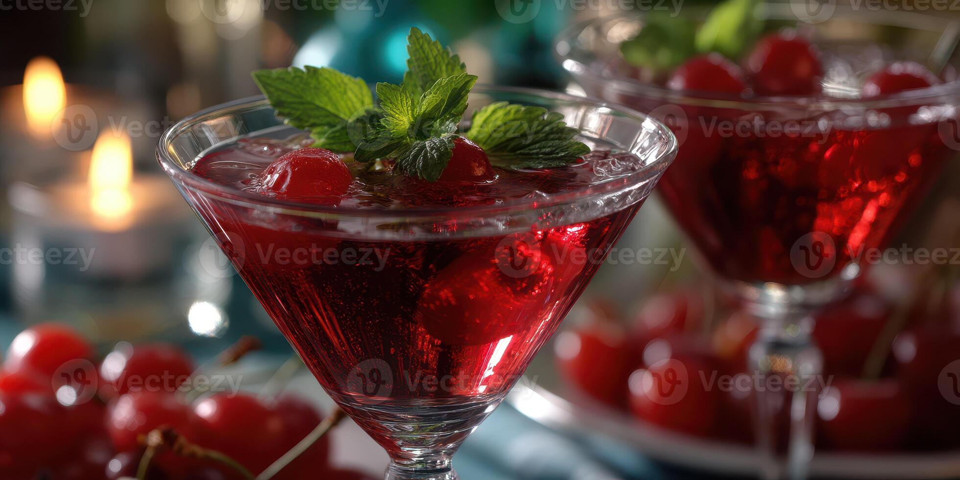 Refreshing cherry cocktails served in elegant glasses at a festive gathering with candles in the background photo