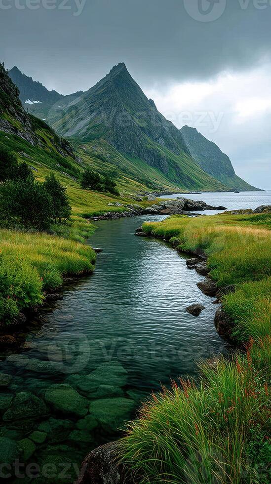 Serene mountain landscape with a winding stream and lush greenery in Norway during cloudy weather photo