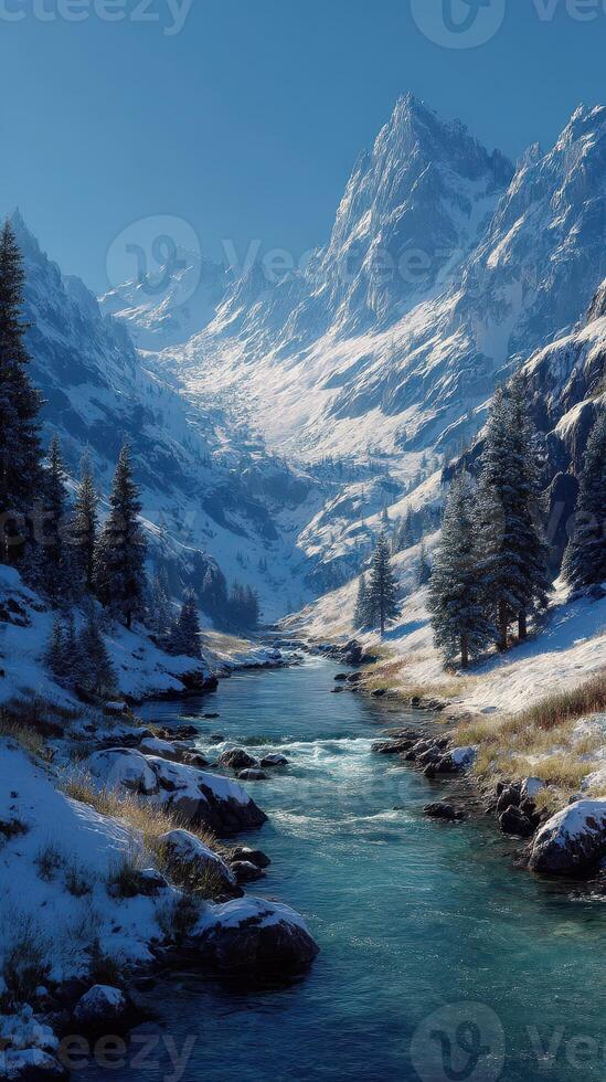 Snowy mountain landscape with river flowing through valley in a clear sky during winter day photo