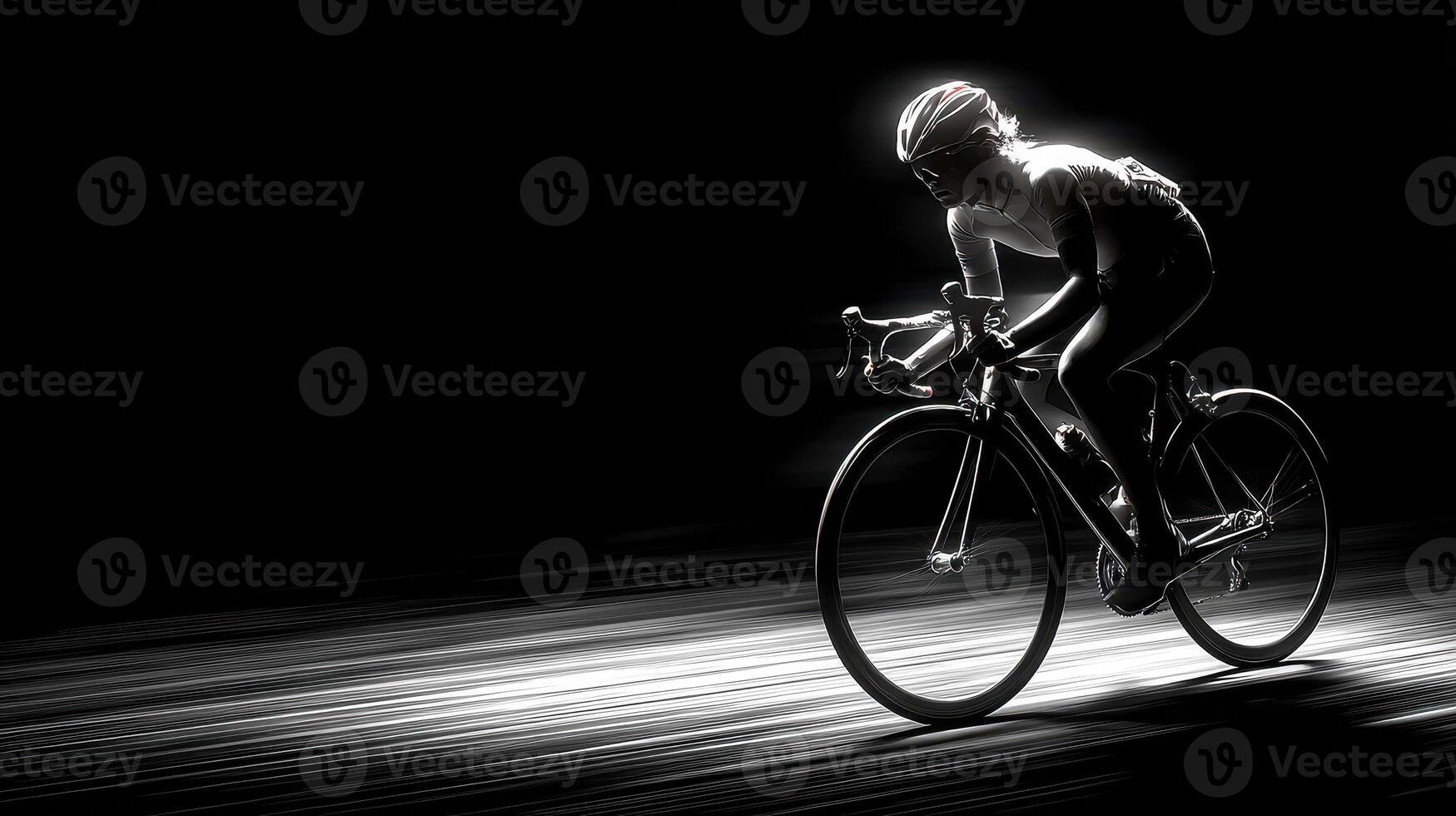 Cyclist in motion riding on a dark road with light trails at night photo