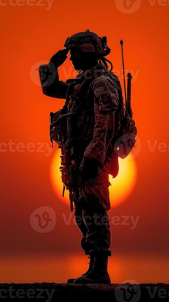 Soldier salutes during sunset, symbolizing honor and duty in a serene landscape photo