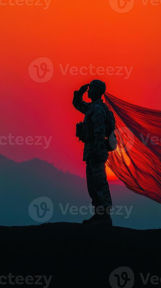 Soldier saluting at sunset with flowing fabric creating a striking silhouette against vibrant colors photo