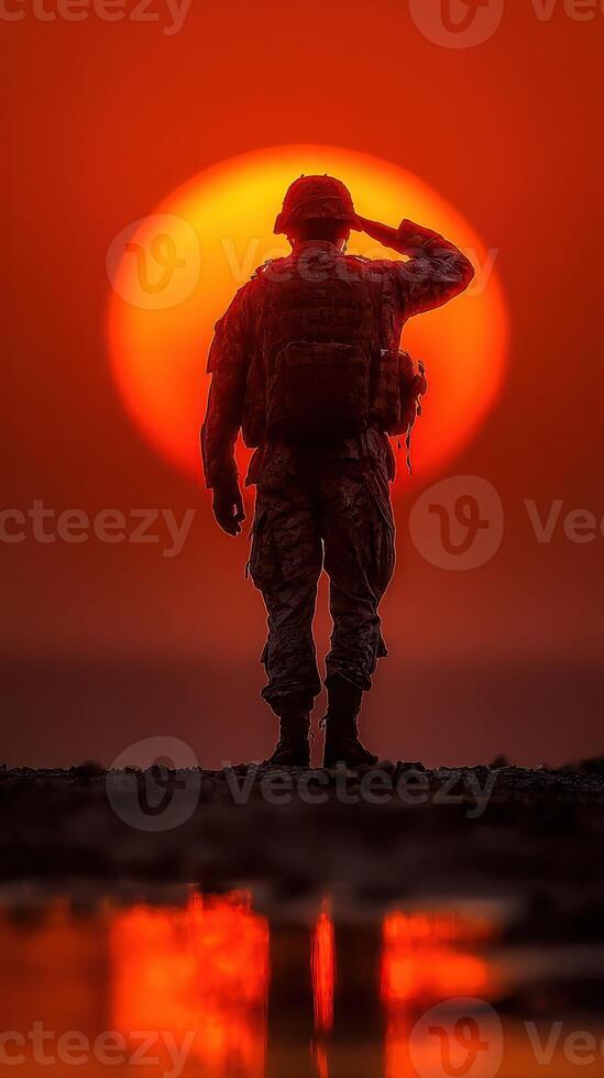 Soldier saluting the sunset on a calm evening at the military base during twilight hours photo