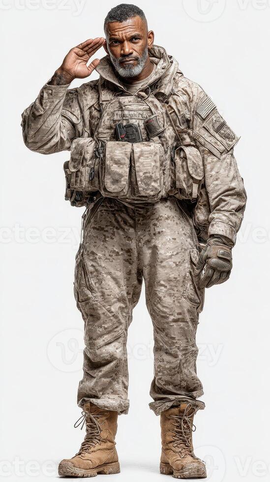 Military soldier in tactical gear performing a salute in a neutral background during a training exercise photo