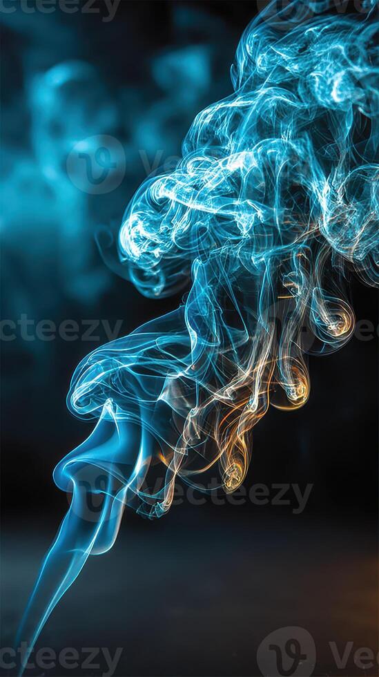 Colorful smoke swirls against a dark background, creating an ethereal visual effect photo