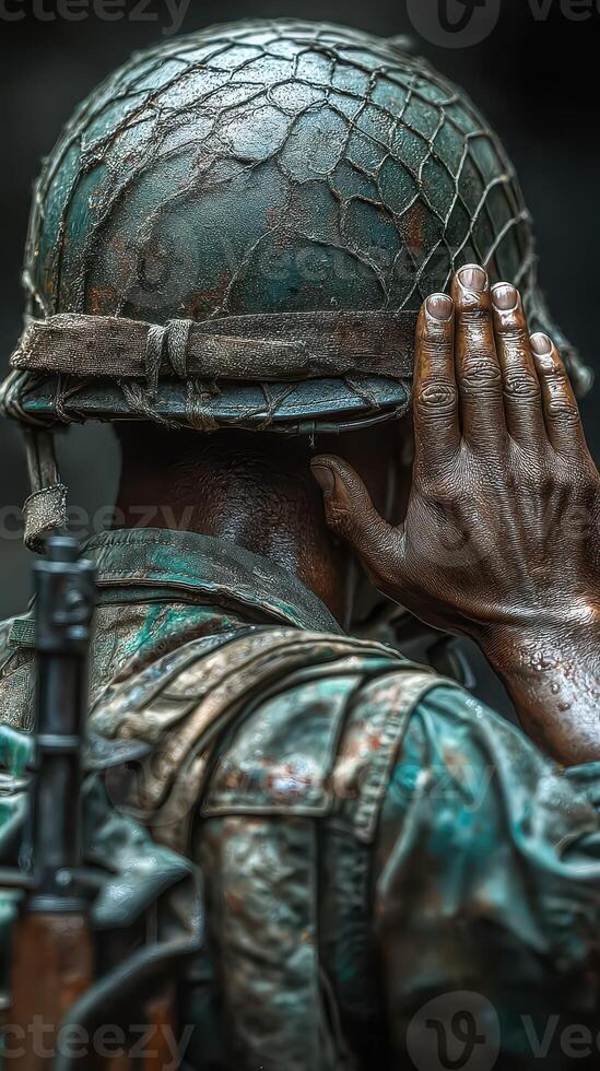 Soldier listening intently while wearing a weathered helmet during a moment of vigilance in a war-torn environment photo