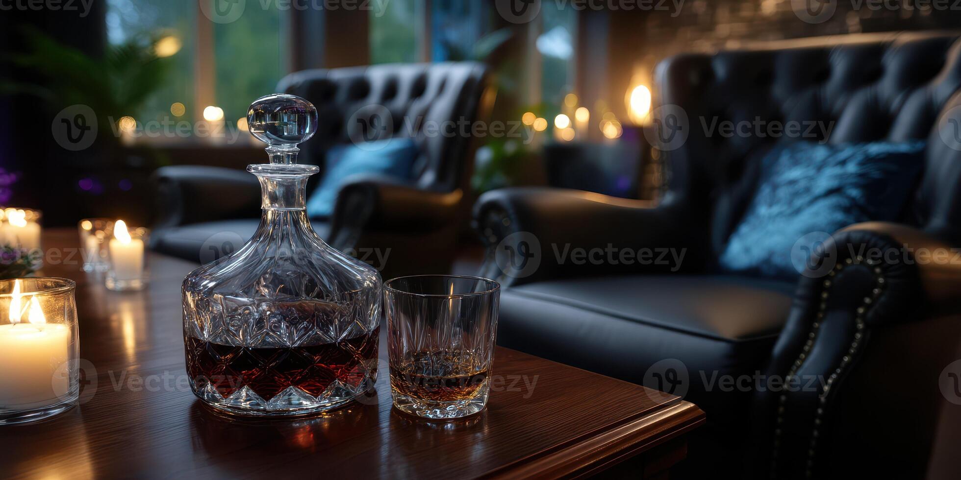 Cozy evening at home featuring elegant glasses and a decanter of whiskey next to flickering candles photo