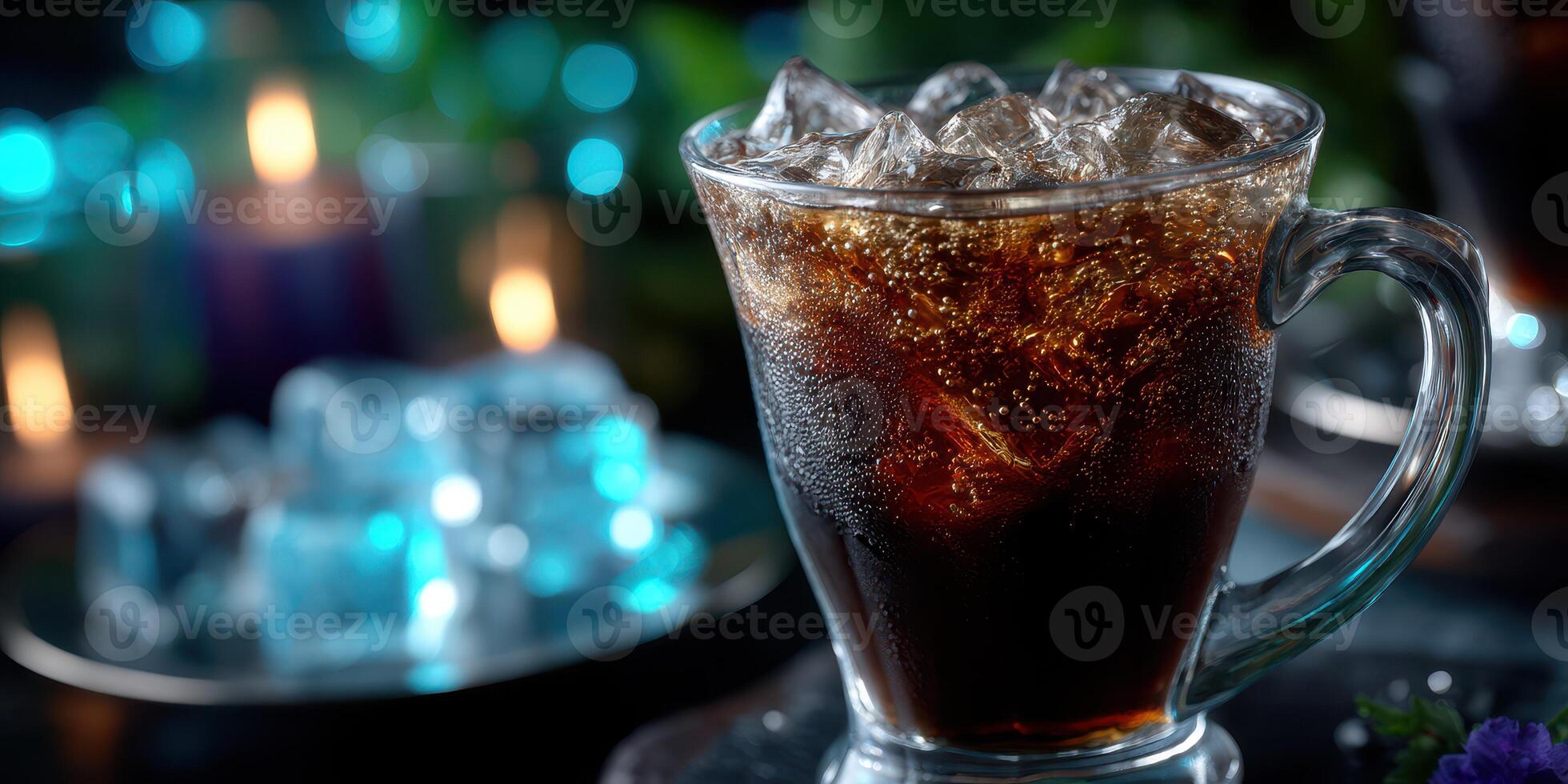 Refreshing glass of cold beverage with ice served at a cozy evening gathering with soft lighting photo
