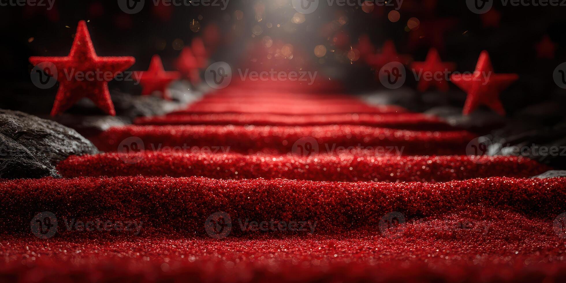 Lush red carpet with stars leading to a light source at an elegant event location photo