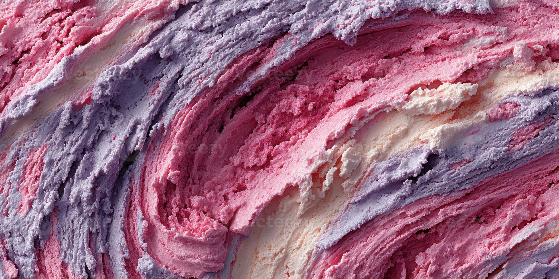 Creamy swirls of colorful frozen dessert with hints of berry and vanilla captured in a close-up view photo