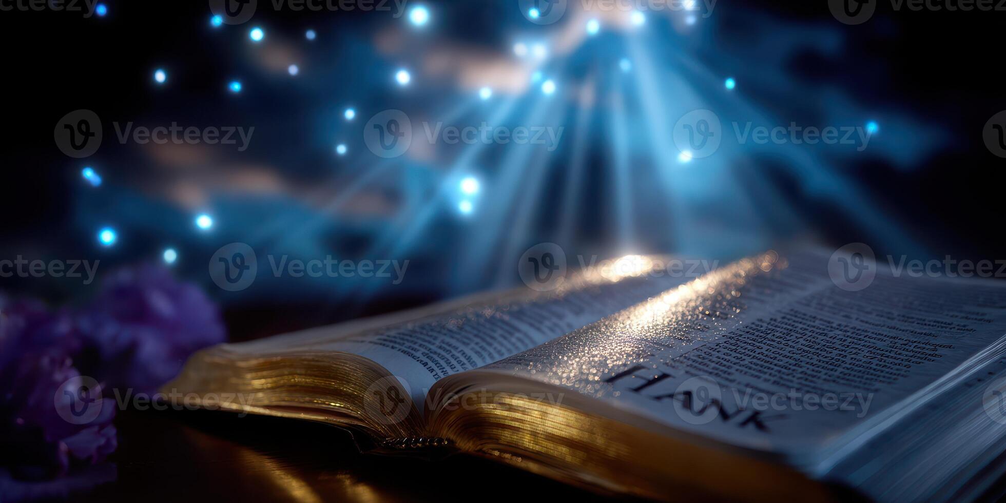 Light rays illuminate an open book with a reflective surface, creating a serene atmosphere in a dark setting photo