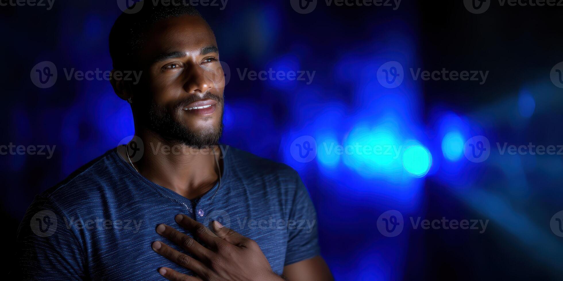 Man expresses emotions in a dimly lit space with blue lighting at night during a personal reflection moment photo