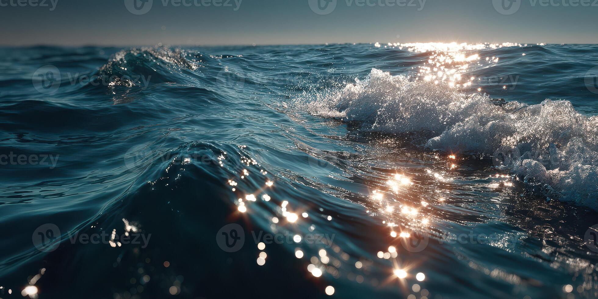 Vibrant ocean waves reflecting sunlight during serene morning hours photo