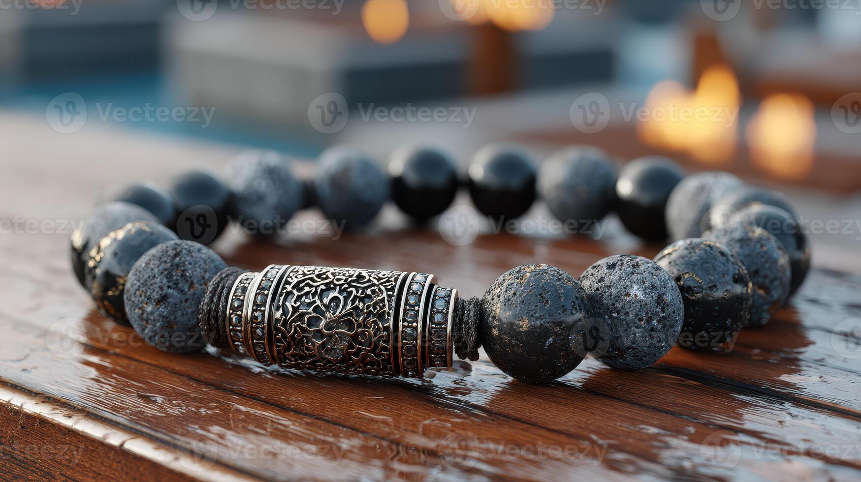 Decorative beaded bracelet with silver accents displayed on a wooden surface outdoors in the evening light photo