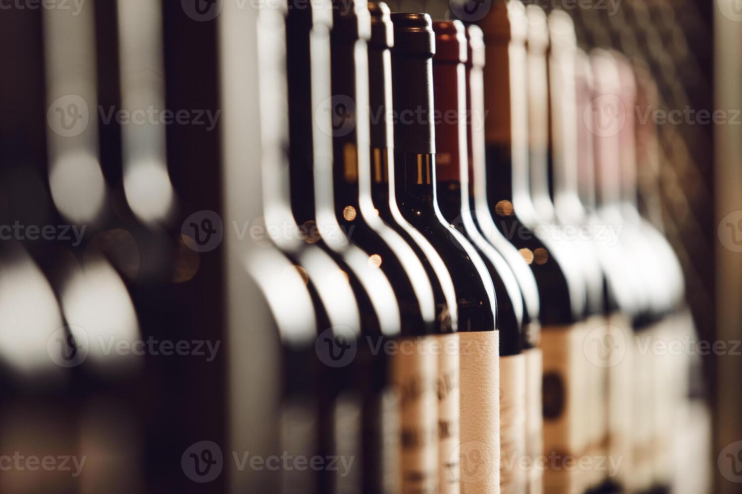 Close-Up View of Wine Bottles Lined Up on Cellar Shelf Highlighting Elite Alcohol Choices photo