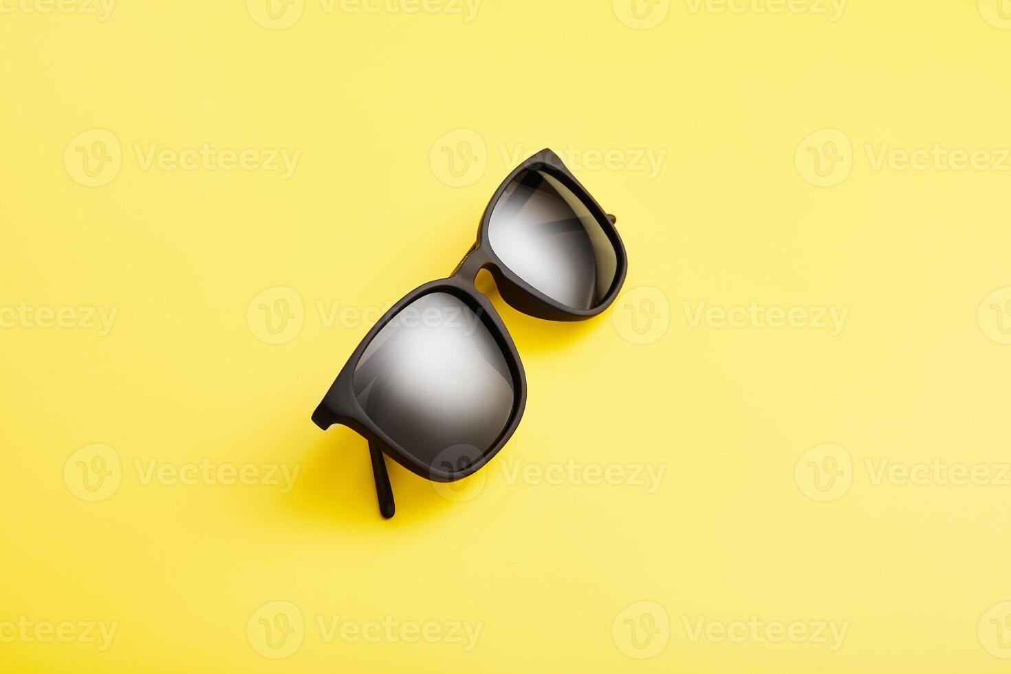 Sunglasses with black lenses, plastic spectacle frame. photo