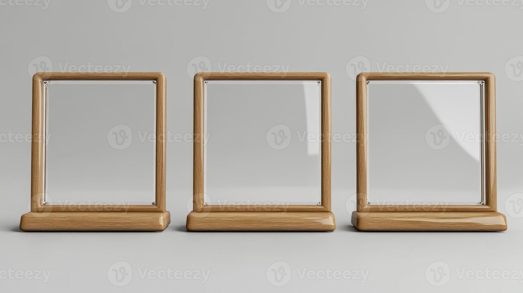 Three wooden frames with glass on them photo
