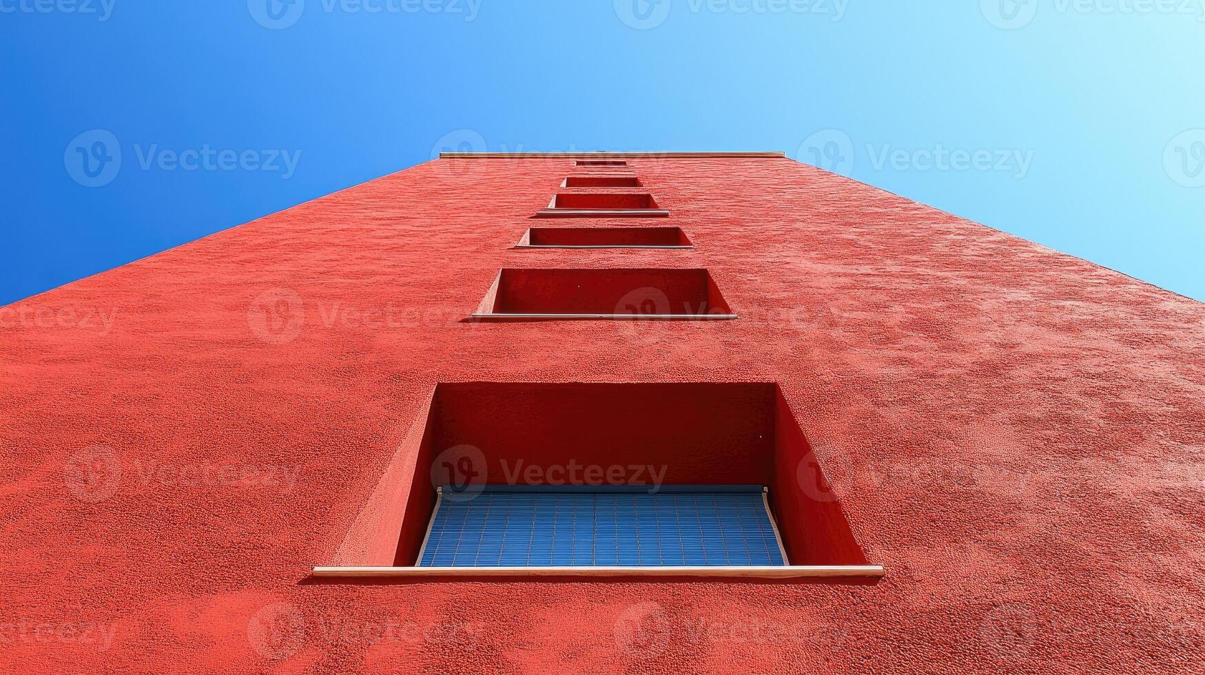 A red building with a window on the side photo