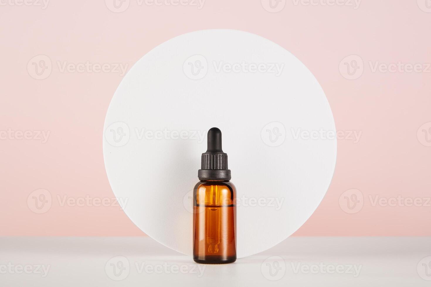 Dropper bottle mockup stands in front of white circle. photo