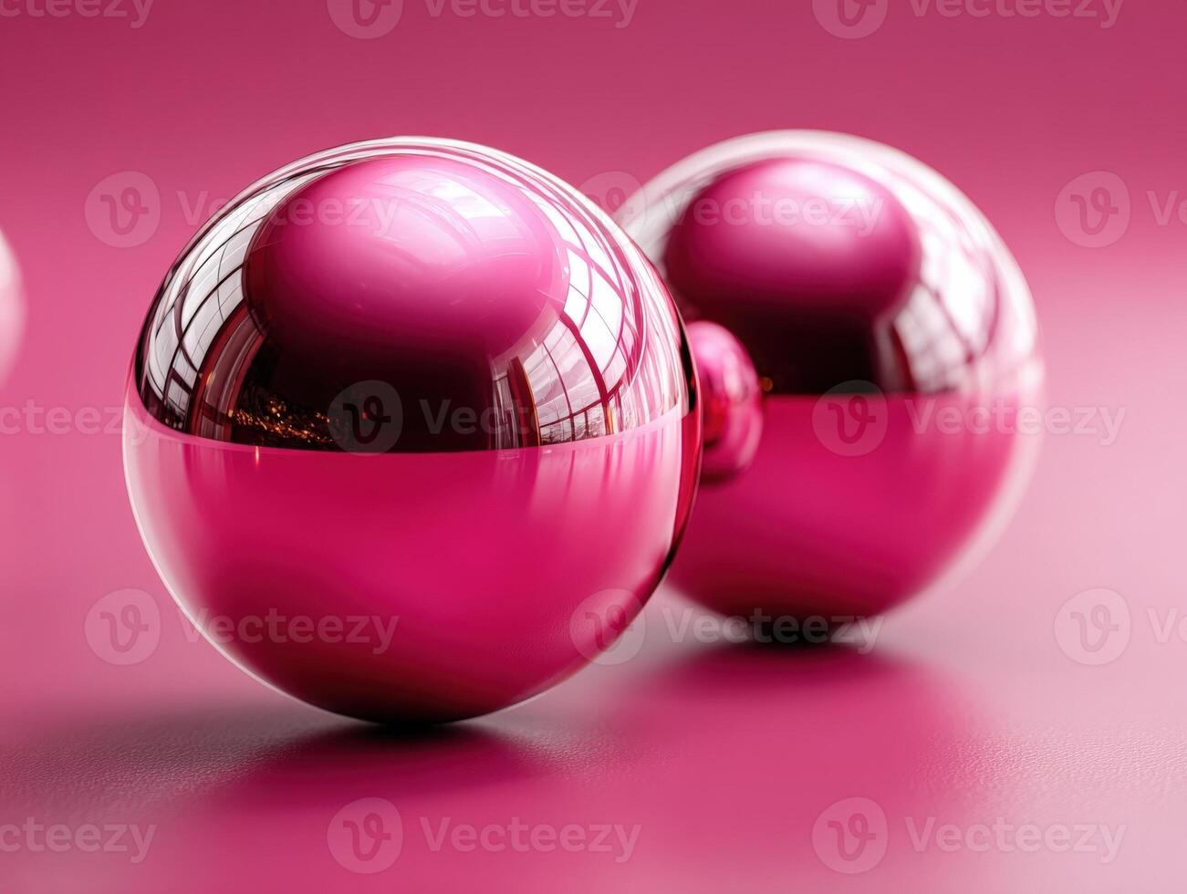 Two shiny pink spheres reflect a window, casting soft shadows on a smooth surface. The spheres display a glossy finish, with a gradient from light to dark pink, enhancing their elegance photo