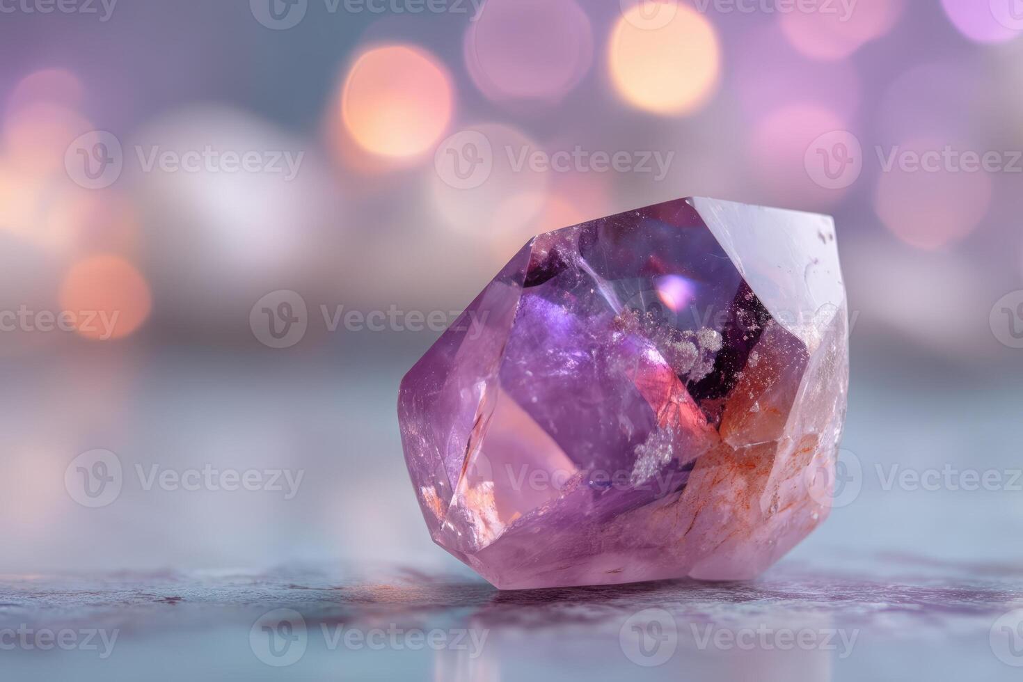 Sparkling purple crystal with faceted edges lying on smooth surface, surrounded by blurred bokeh lights in warm tones, highlighting its vibrant hues and intricate details photo