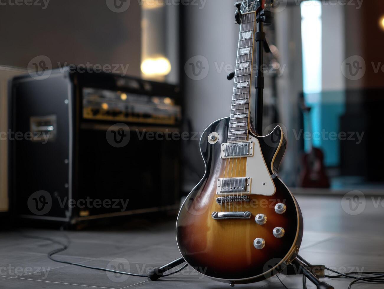 Sunburst electric guitar on a stand in a studio setting with an amplifier in the background, soft lighting reflecting off the guitar's polished body, highlighting its elegant curves photo