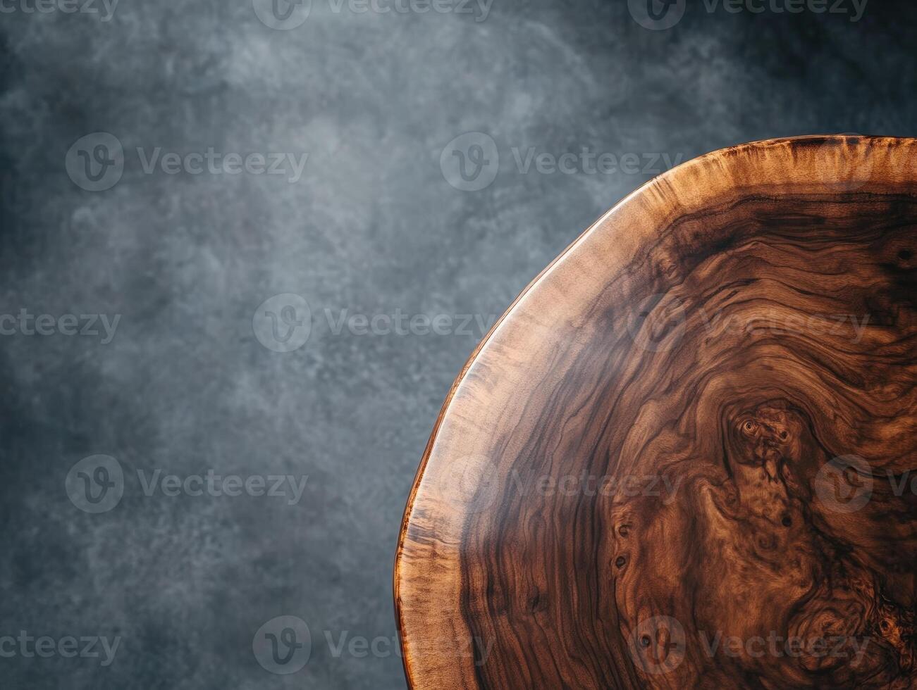 Close-up of a round wooden table with distinctive grain patterns on the top right corner against an undefined background, highlighting natural textures and craftsmanship photo