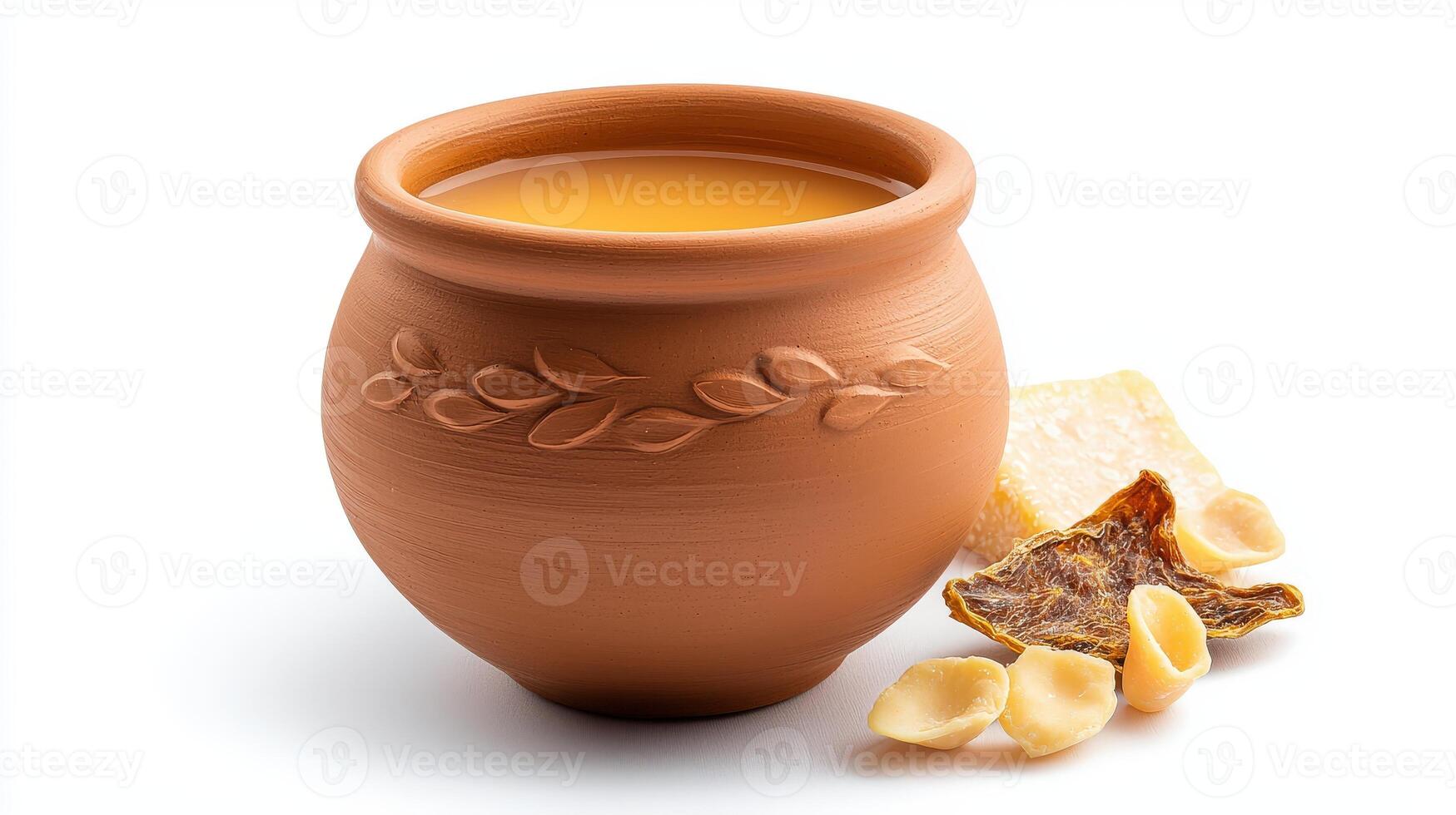 A clay pot with a slice of cheese and a piece of bread photo