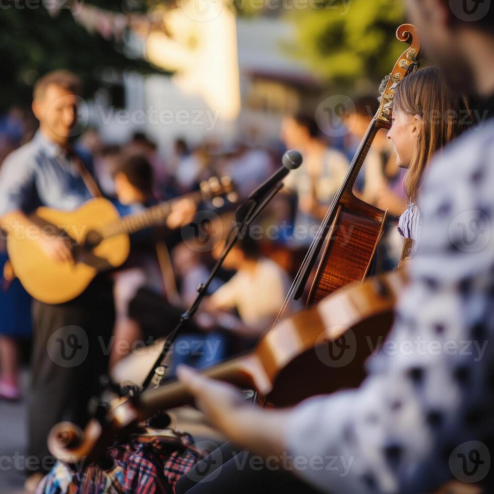 A group of people playing music in an outdoor setting photo