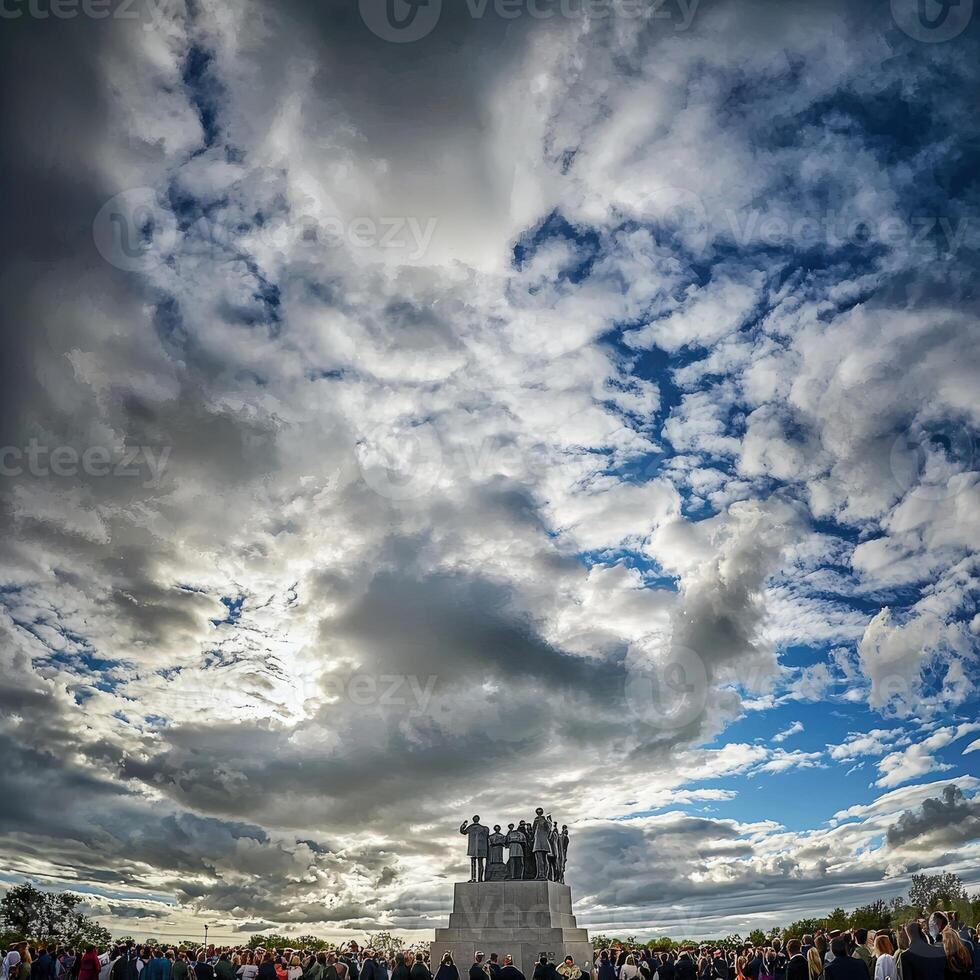 A crowd of people standing in front of a monument photo