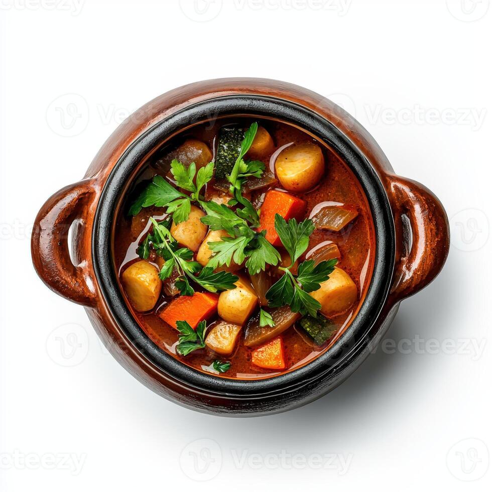 Vegetarian stew in a brown pot on a white background photo