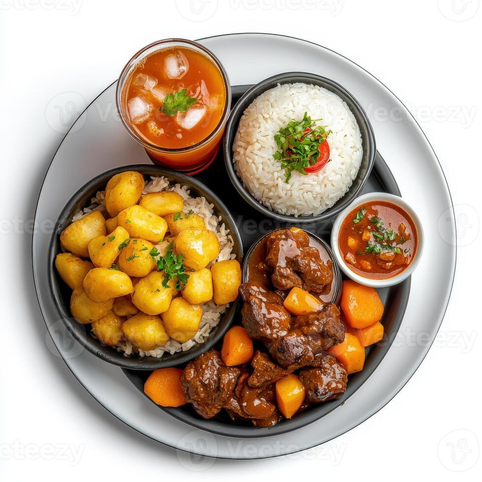A plate with meat, rice, vegetables and a drink photo