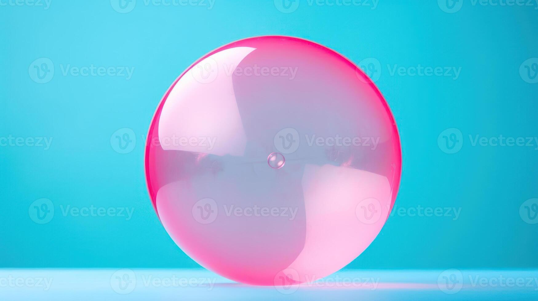A vibrant pink balloon against a blue background. photo