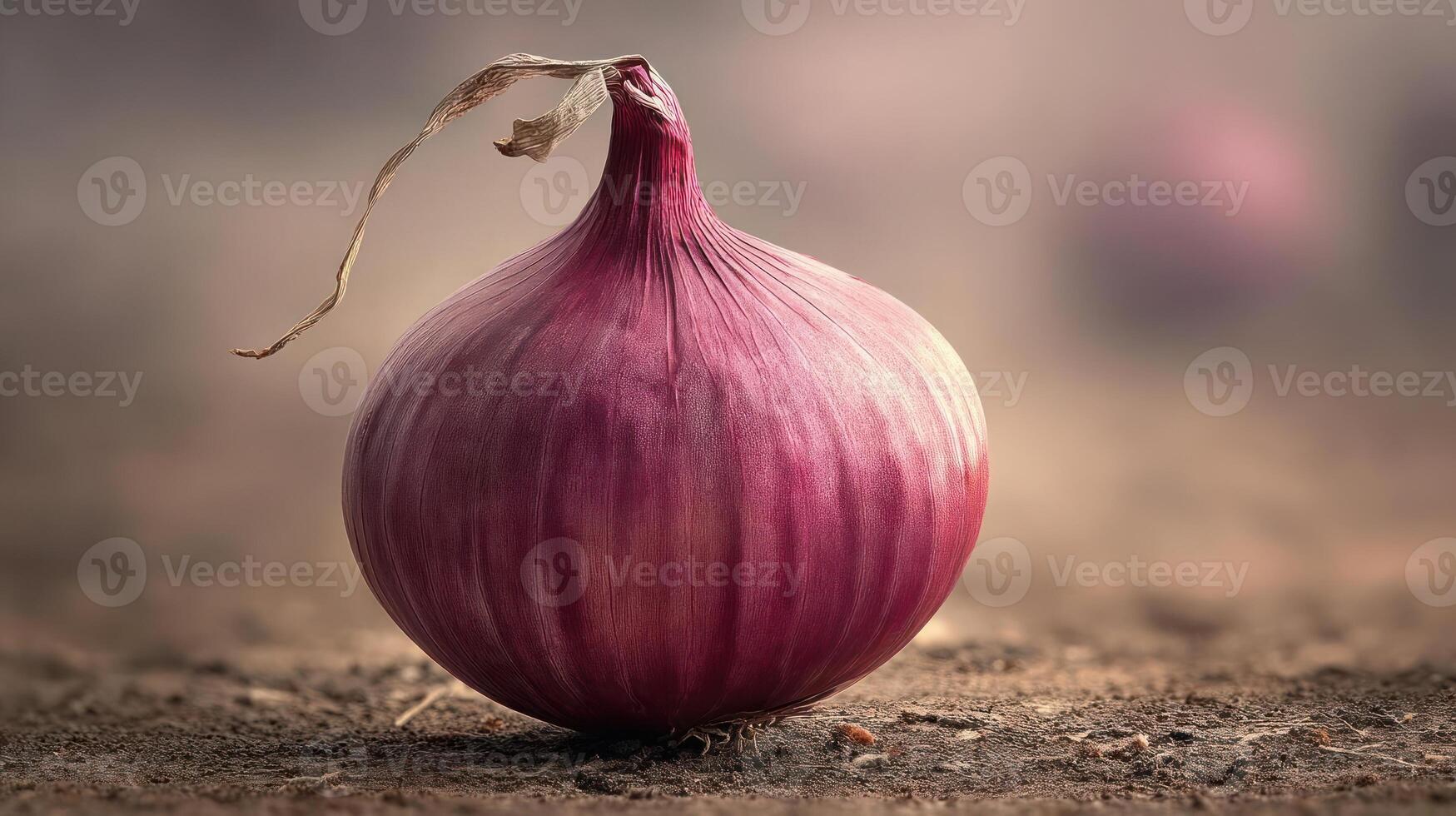 A vibrant red onion with a delicate stem. photo