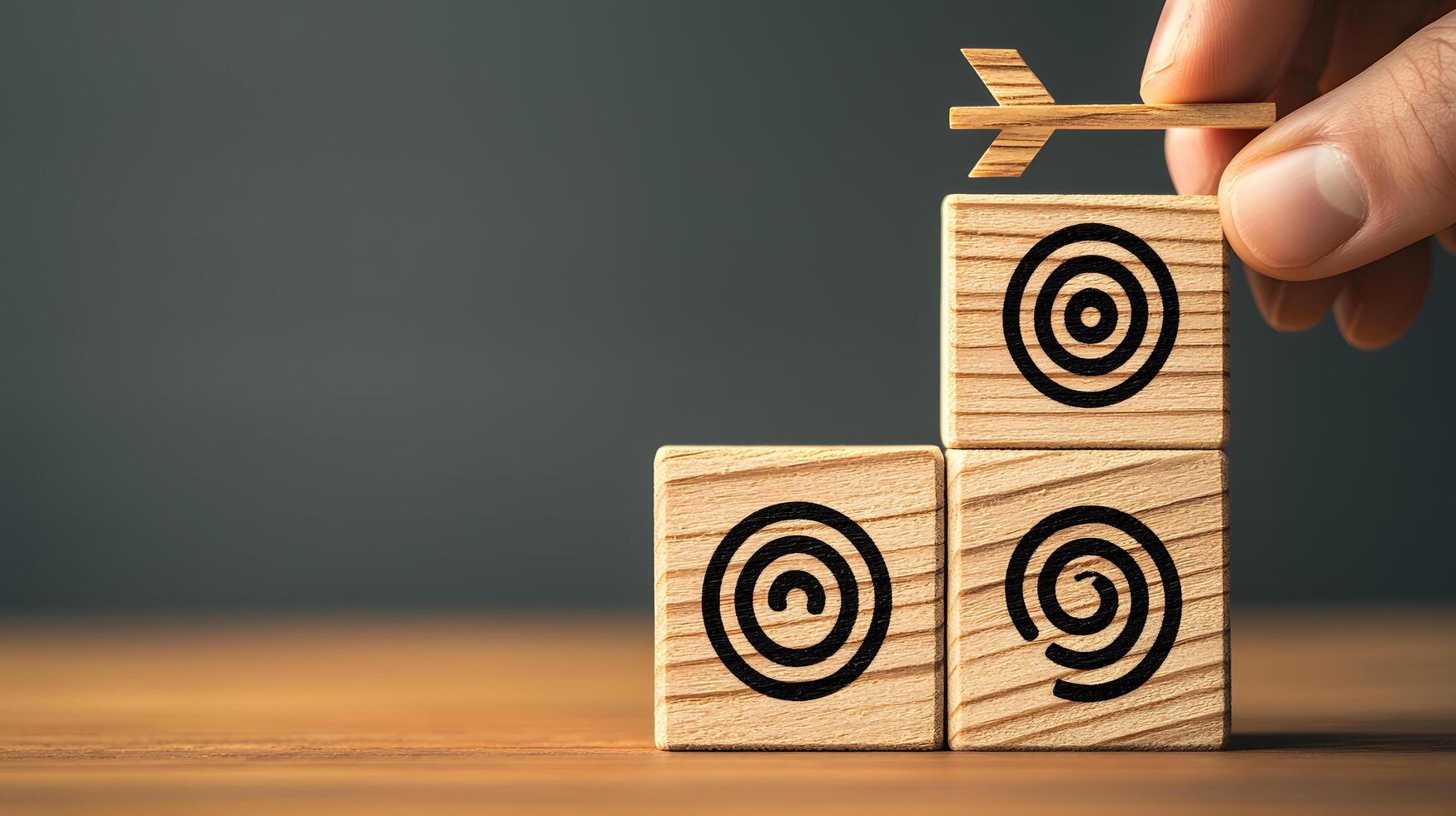 Reaching Goals Stacking Wooden Blocks with Target Icons and Arrow for Strategic Success photo