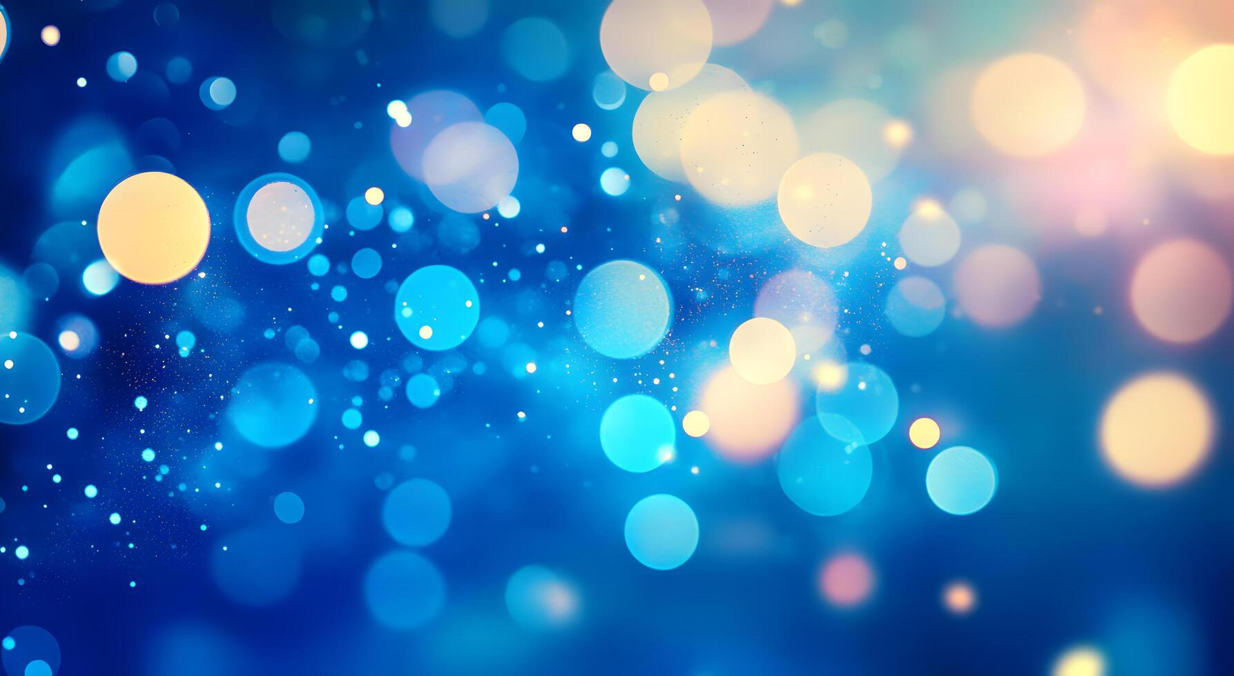 Abstract blue bokeh background features sparkling light with blurred, glowing circular shapes creating a festive atmosphere photo