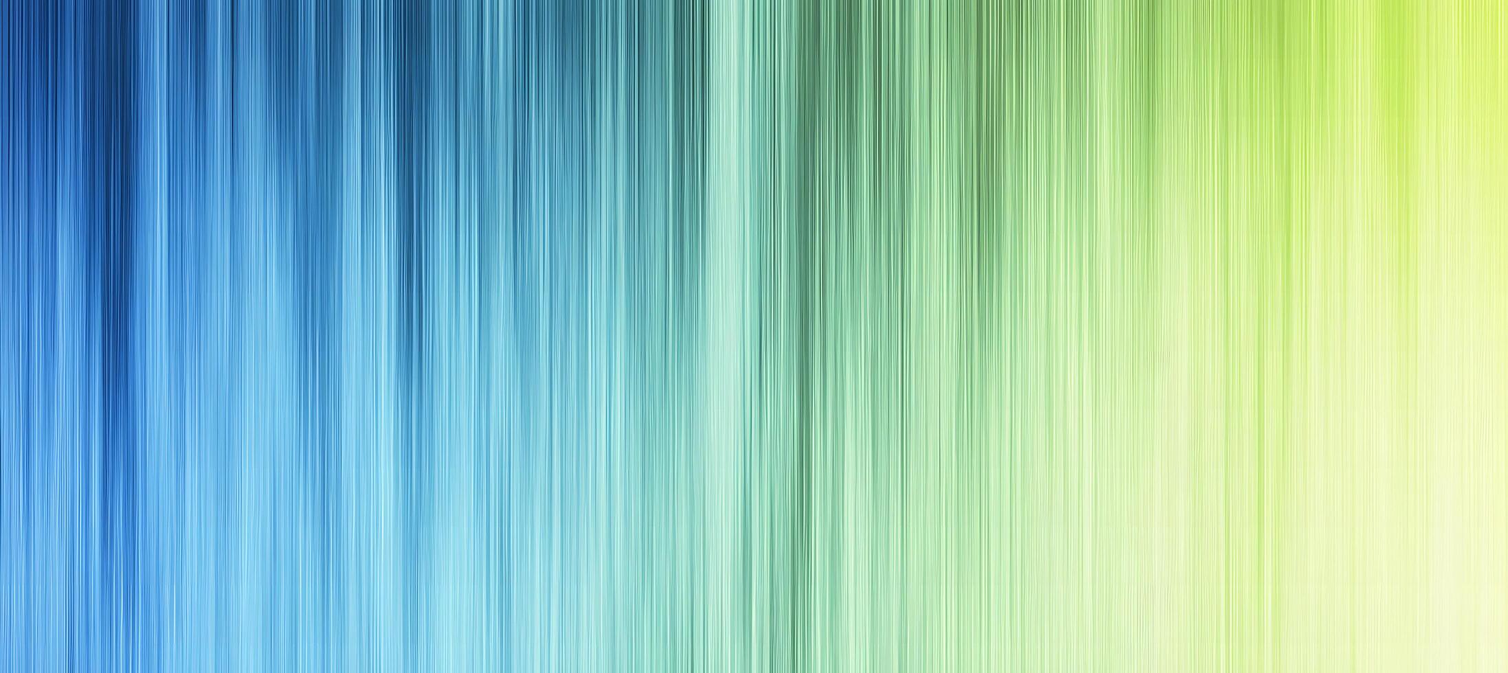 Blended shades of blue transform into green and yellow in this abstract pattern photo