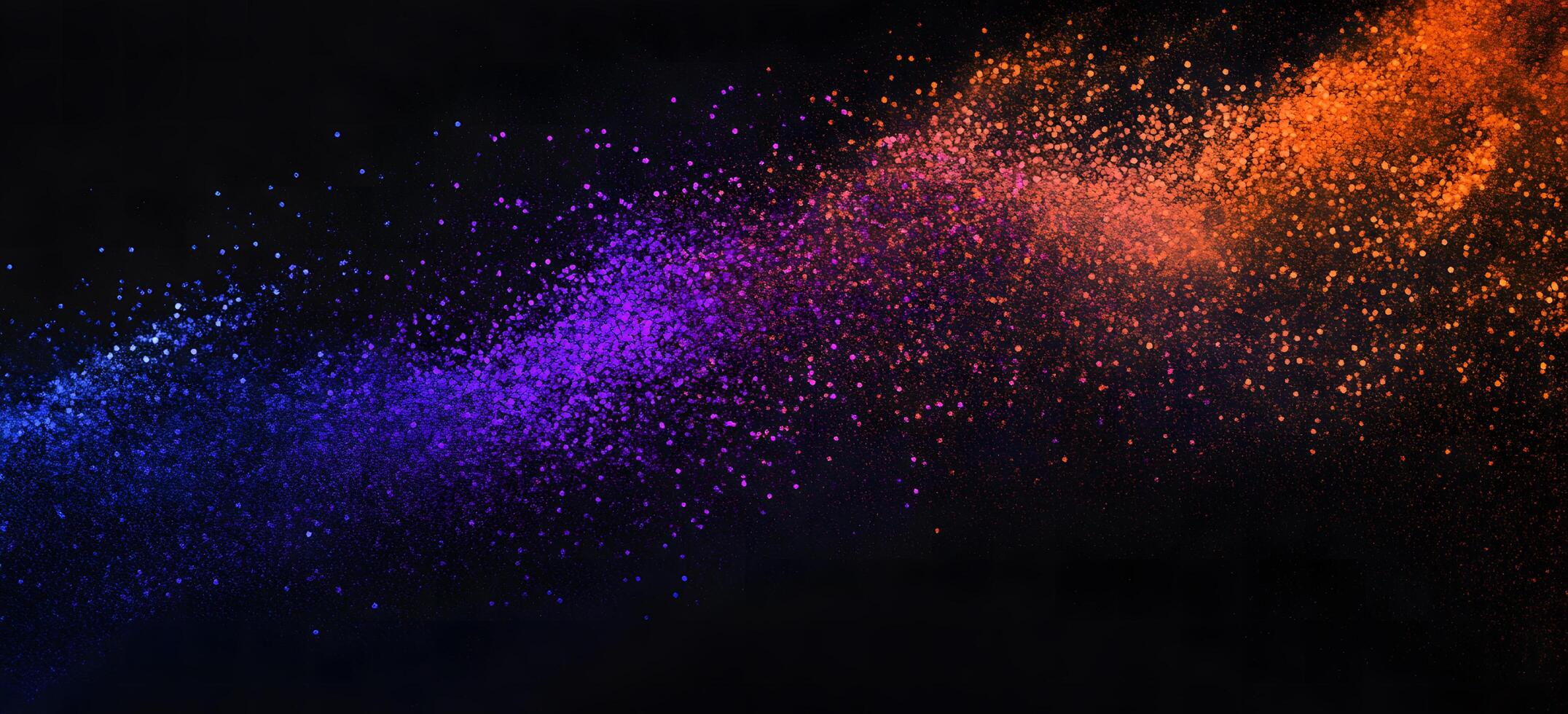 Blue, purple, and orange particles blend beautifully against a dark background creating a vibrant contrast photo