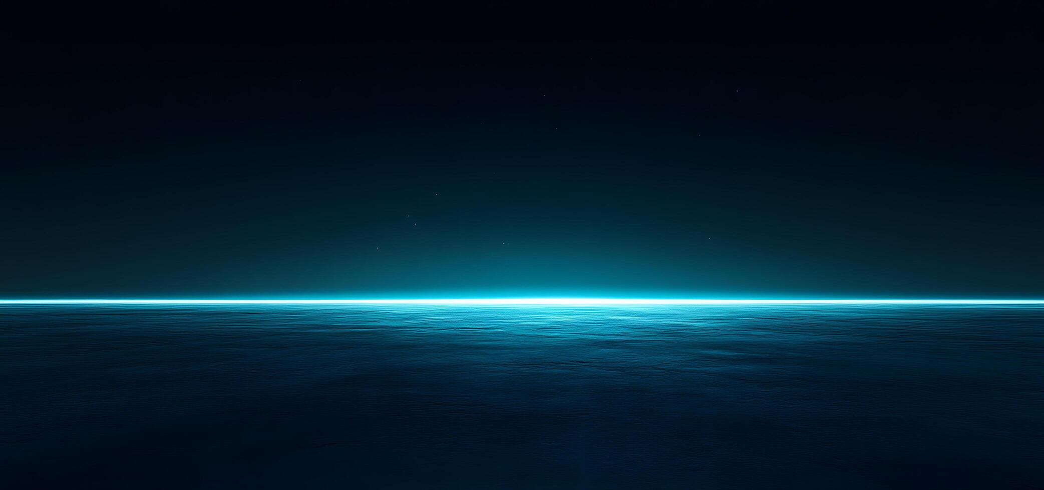 Glowing cyan horizon illuminates the vast expanse of dark water under the starlit sky photo