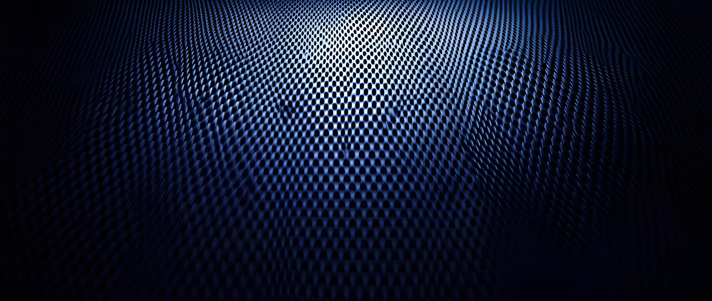 Light highlights a dark blue textured surface with a pattern of repeating oval shapes photo