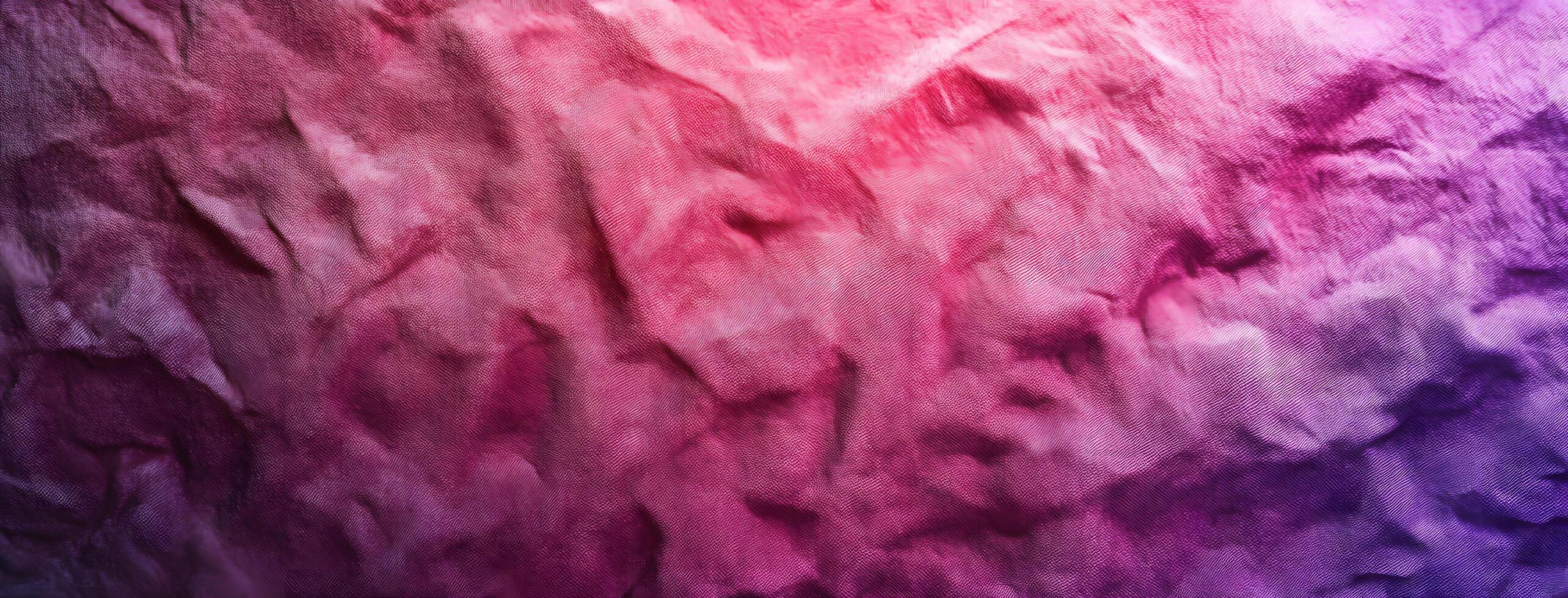 Pink purple fabric texture shows detailed wrinkles for a textured textile background image photo