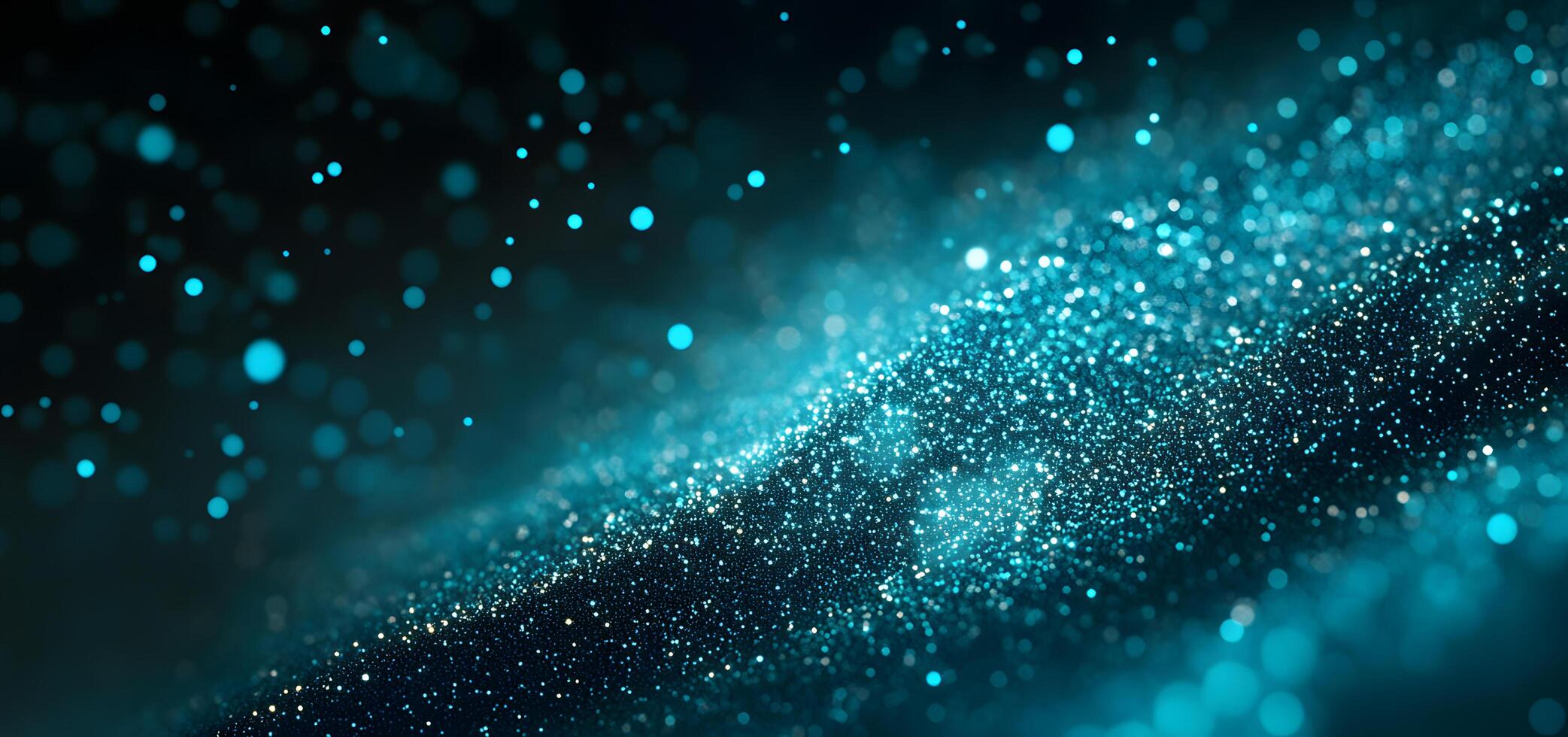 Shimmering blue sparkles create a magical dustlike cloud effect against dark background photo