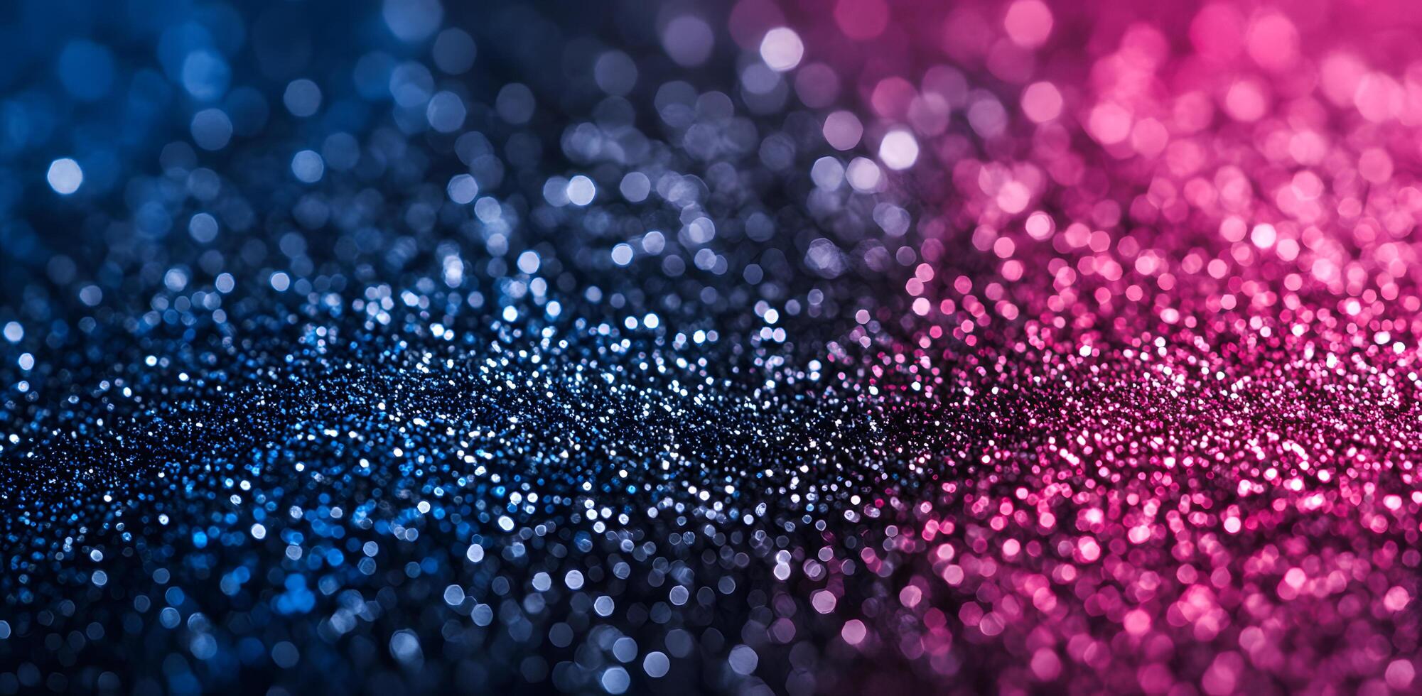 Shimmering bokeh background transitions from blue to vibrant pink with blurred sparkly lights photo