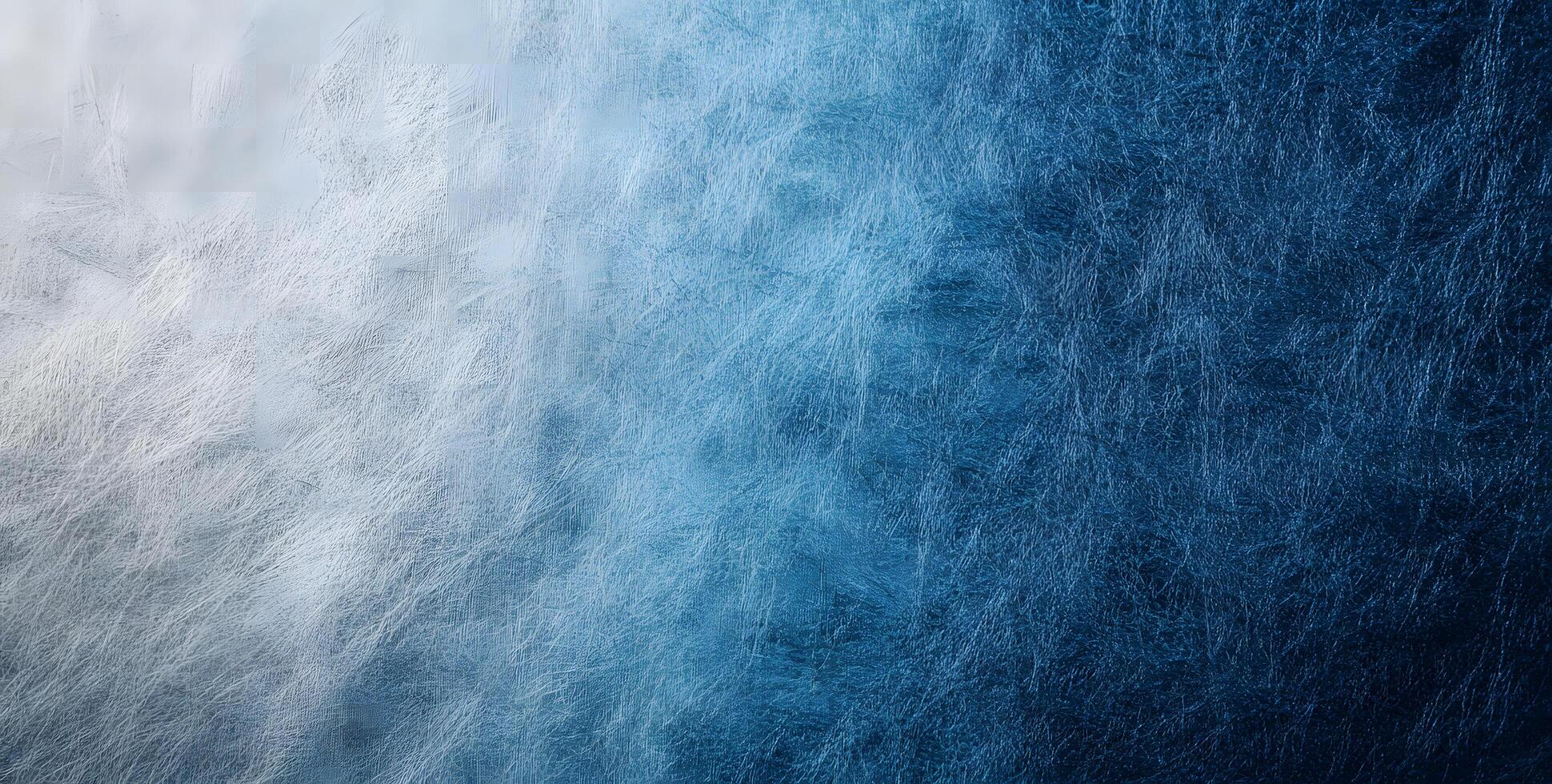 Smooth transition from frosted white to deep blue creates a textured gradient background photo